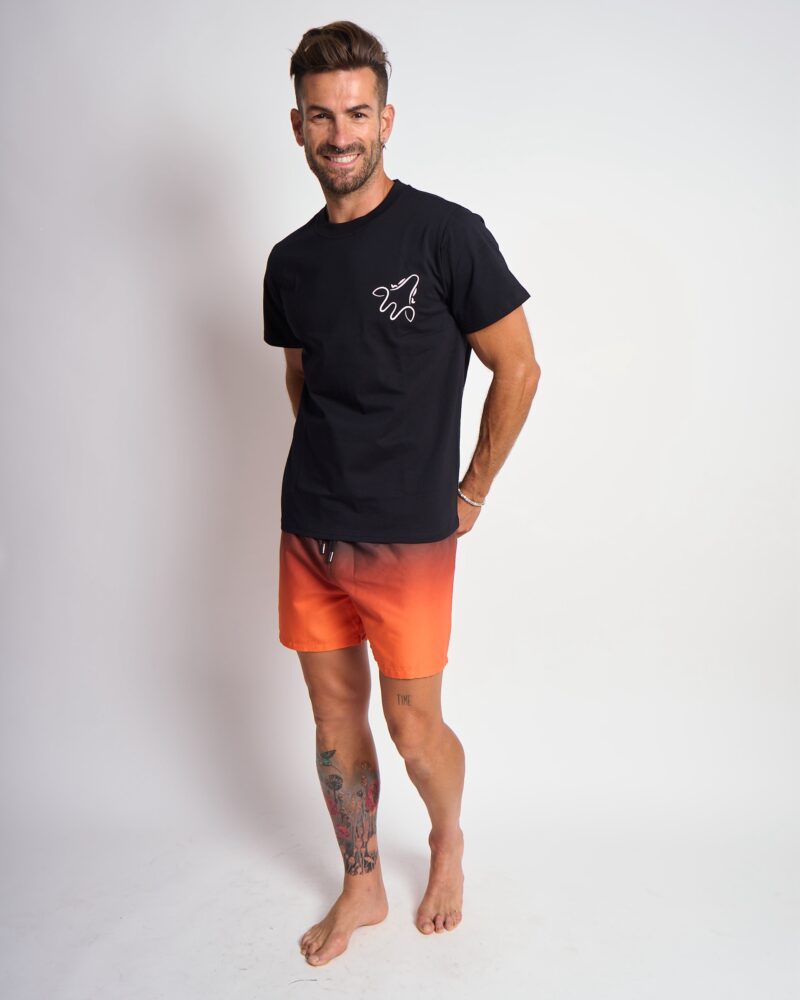 Black T-shirt with white Wildgiraffes logo and gradient on the back